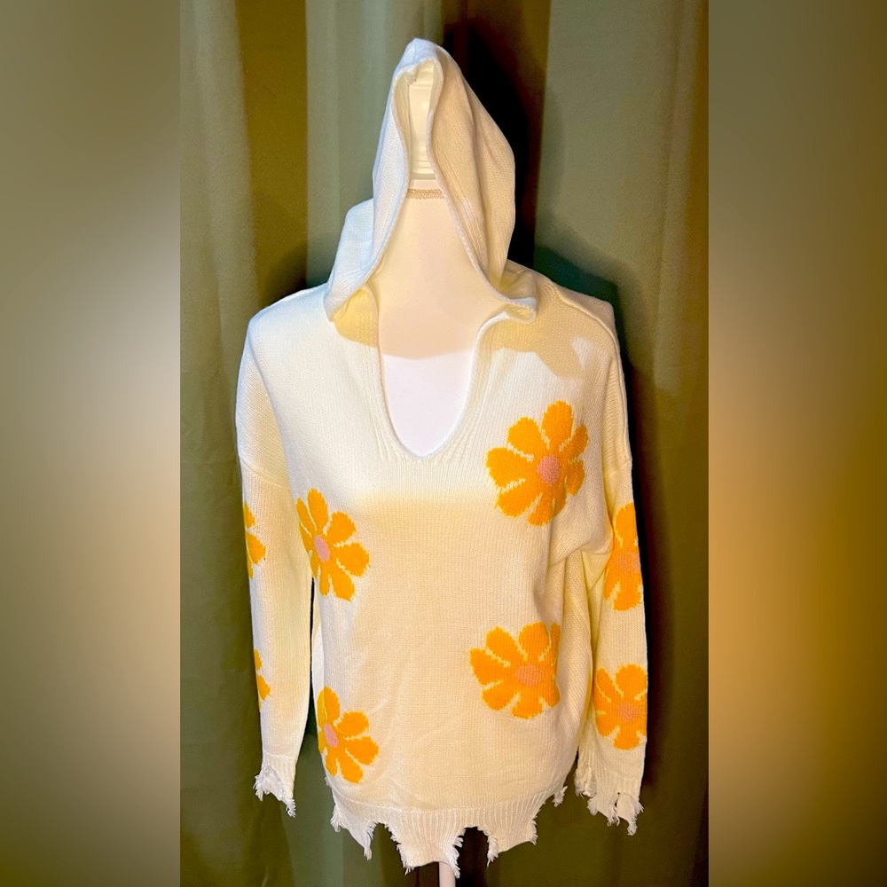 Super cuter cream colored Hazel Moon sweater with yellow and pink flowers.